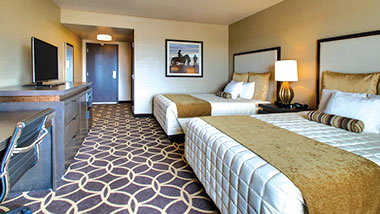 A deluxe room with two queen size beds at Zia Park Casino, Hotel and Racetrack..