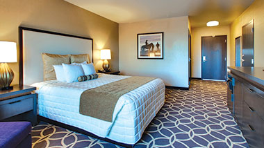 An extended room with a king size bed at Zia Park Casino, Hotel and Racetrack..