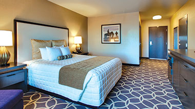 An extended room with a king size bed at Zia Park Casino, Hotel and Racetrack..