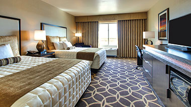 A deluxe room with two queen size beds at Zia Park Casino, Hotel and Racetrack..