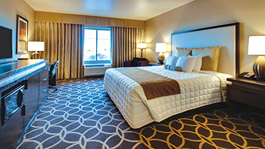 An extended room with a king size bed at Zia Park Casino, Hotel and Racetrack..