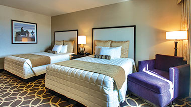 A deluxe room with two queen size beds at Zia Park Casino, Hotel and Racetrack..