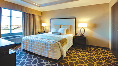 A king size bed in the deluxe suite at Zia Park Casino, Hotel and Racetrack.